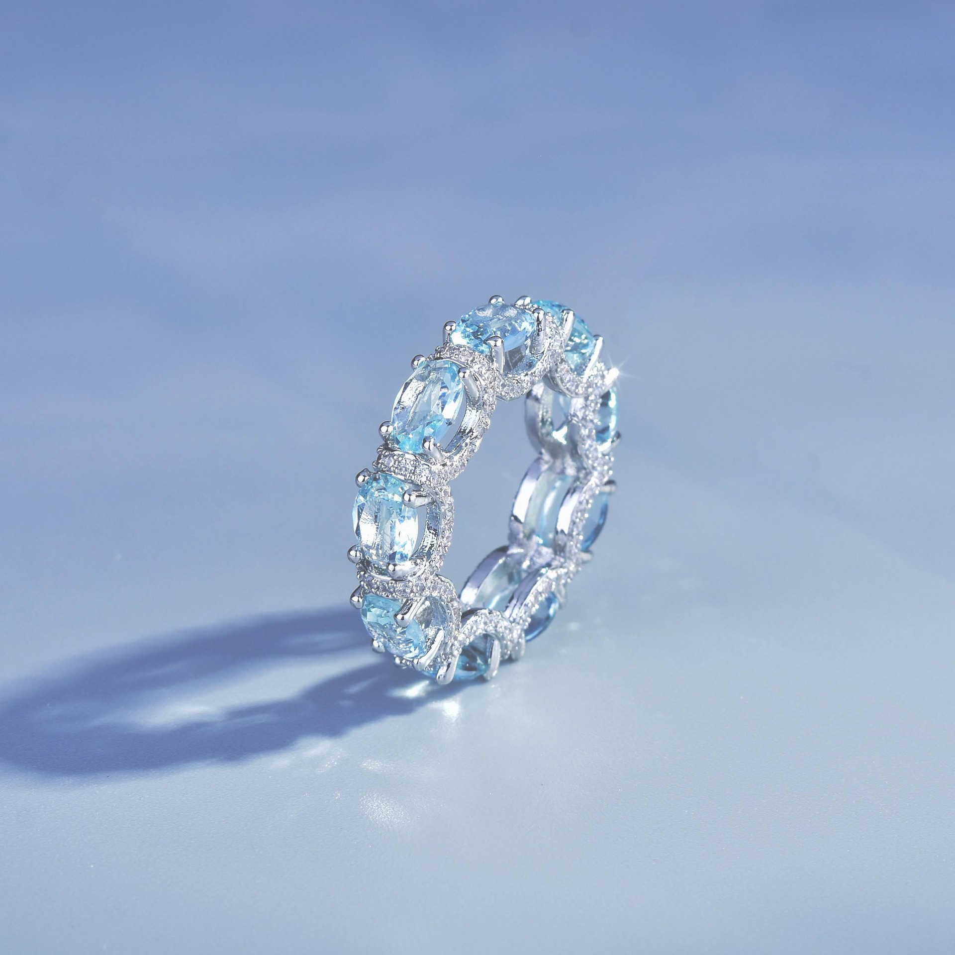 Luxury Oval Cut Aquamarine Eternity Band Ring, Micro Pave Blue Gemstone Stackable Ring For Women - Image 3